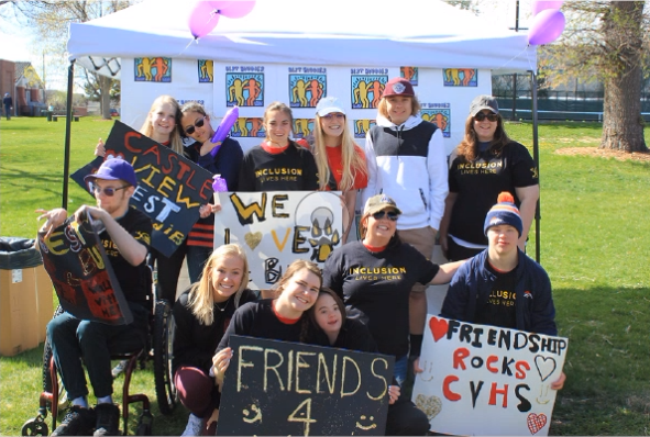Students from the Castle View chapter pose for a photo in front of a back drop before starting the walk. The group made posters the week before, to show their spirit. “It was really fun and I liked playing lots of games. I will definitely do it again next year,” junior Ethan Snow said.