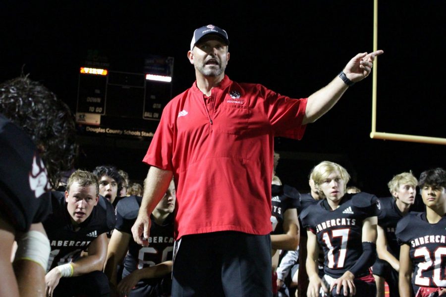 Ready for battle: On Sept. 17th, coach Eric Handke prepares his team for battle against the DOuglas County Huskies. With this long awaited rivalry, the boys are ready for a night to remember