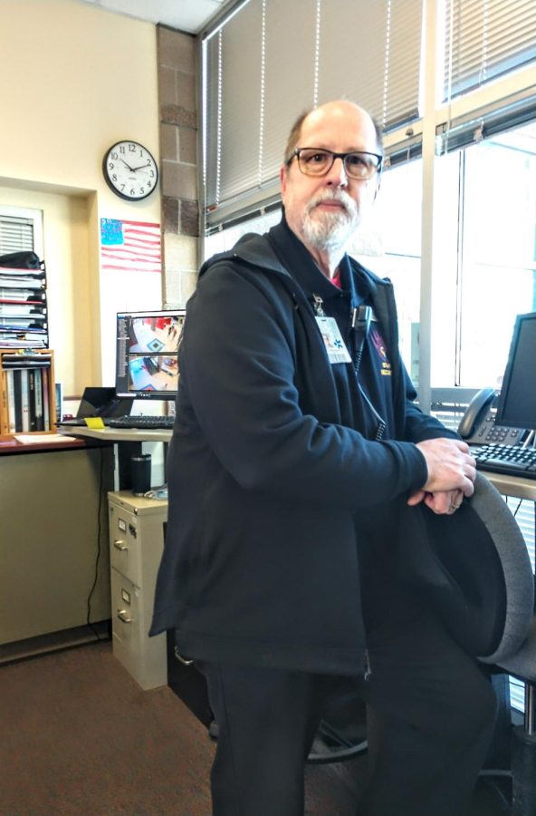 Security Guard Andy Hischar getting ready for another day. During second period it's Andy's post to watch the front doors. He says 'Hi' to everyone that comes in.  