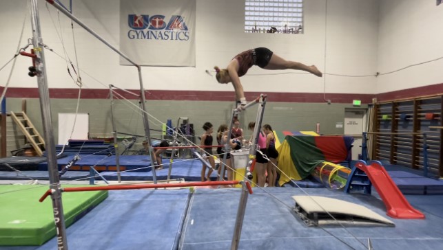 As+sophomore+Meghan+Winston+mounts+the+bar%2C+she+hits+her+connection+and+is+above+horizontal%2C+guaranteeing+a+10.00+start+value.+She+attends+a+meet+at+Castle+Rock+Chameleon+Gymnastics+and+ends+with+a+great+score.+%E2%80%9CSometimes+I+get+nervous+but+the+excitement+always+kicks+in+the+second+a+hand+touches+the+apparatus%2C%E2%80%9D+Winston+says.