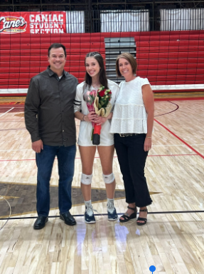 All of the volleyball seniors take pictures with their families and the rest of the seniors. Lauren Gonzalez takes photos with her parents for the last time during high school season. “ The best part is being able to do all the experiences like dressing up for games.” said Gonzalez.